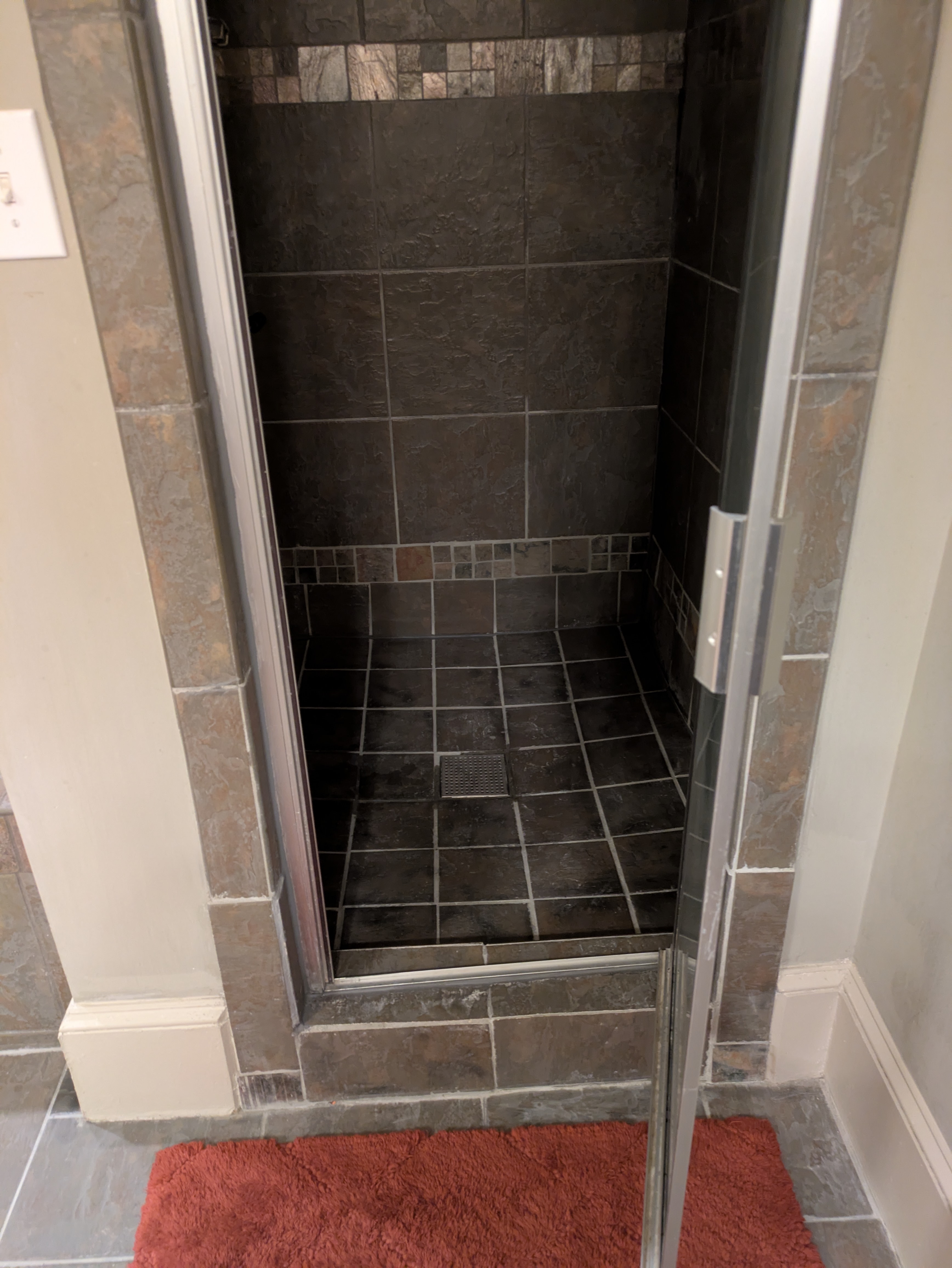 Frameless glass shower door in a modern Athens bathroom